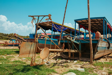 Fototapeta na wymiar Floating Village Boats on the river in Cambodia near Pean Bang and Tonle Sap Lake