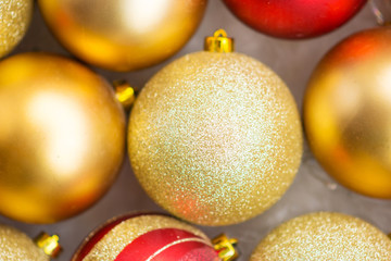 red and gold christmas balls, christmas lights, flat lay christmas photo