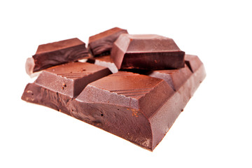 Chopped chocolate bar isolated on white background