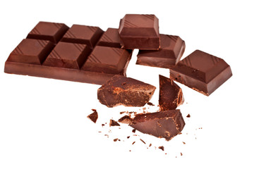 Chopped chocolate bar isolated on white background