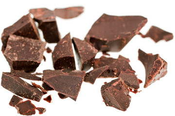 Chocolate pieces isolated on white background. Top view.