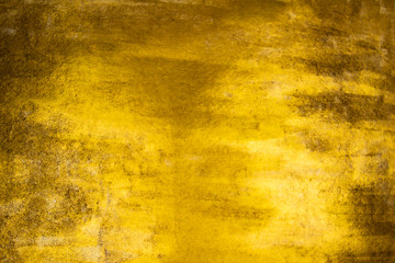 Gold background with scuffs. Golden Background and texture. Shiny gold and yellow background,