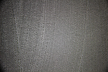 A black background with white texture on it.  A nice black background with a chalk texture on it