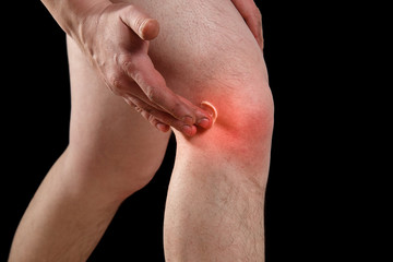 rubbing medicated ointment into the affected knee