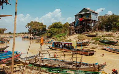 Floating Village Boats on the river in Cambodia near Pean Bang and Tonle Sap Lake