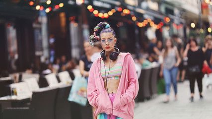 Urban portrait of eccentric young woman model on the streets