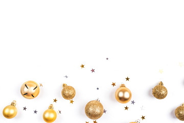 Fototapeta premium Festive white background with gold Christmas decorations. Flat lay, top view. Copy space for text.