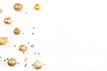 Festive white background with gold Christmas decorations. Flat lay, top view. Copy space for text.