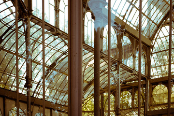 The Palacio de Cristal. "Crystal Palace" is a glass and metal structure located in Madrid's Buen Retiro Park.