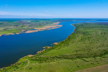 Drone shot aerial view scenic landscape a big river against a blue sky