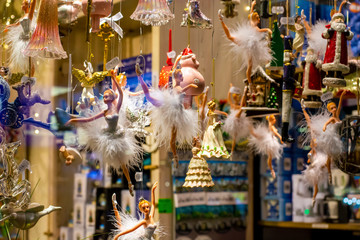 Shop window with festive hanging Christmas decorations