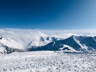Fotobehang mountains in winter © Jana