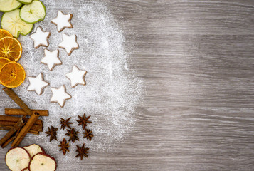 baked cinnamon stars on a kitchen table at Christmas time