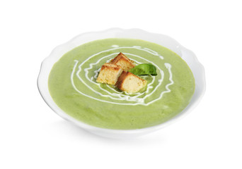 Delicious broccoli cream soup with croutons isolated on white