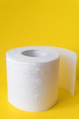 toilet paper on yellow background