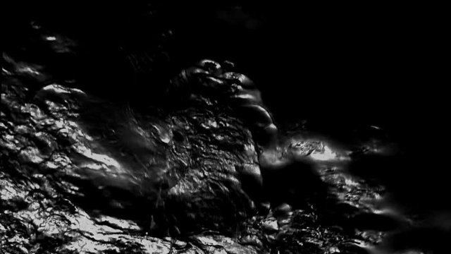 Background pouring black petroleum oil. Flows Natural oily flammable liquid.