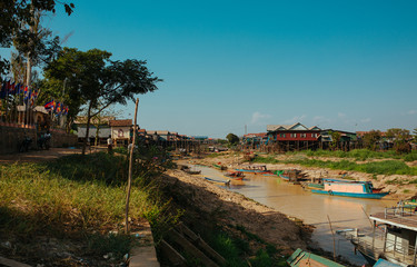 Fototapeta na wymiar Floating Village Boats on the river in Cambodia near Pean Bang and Tonle Sap Lake