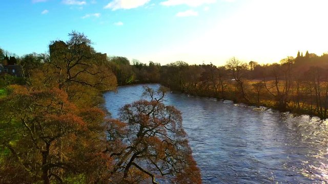Aerial Panning Shot From Drone Of A Rural Scene In Scotland With River And Castle
