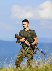 Fototapeta premium Guard the borders. Man with weapon military clothes in field nature background. Soldier with rifle. Army forces. State border guard service. Protecting borders of motherland. Stop illegal immigrants