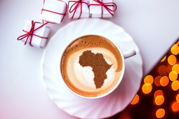 Cup of cappuccino with a picture of Africa