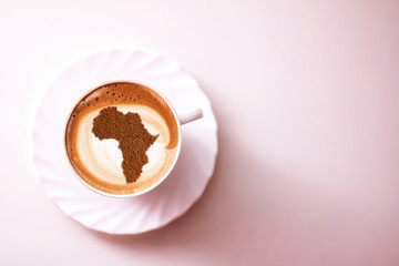 Cup of cappuccino with a picture of Africa