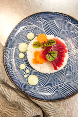 Plating ahi tuna and carrot dish