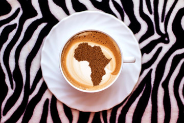 Cup of cappuccino with a picture of Africa