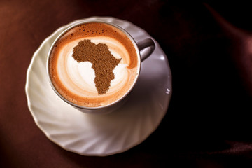 Cup of cappuccino with a picture of Africa