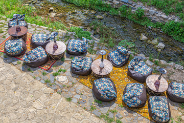 Hookah cafe in the gorge, on the Bank of a mountain river