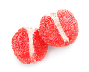 Pieces of fresh grapefruit on white background
