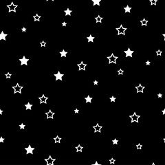 The seamless pattern with white stars on a black background. Vector.