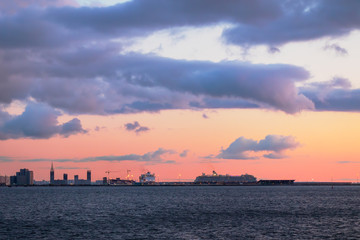 View of the seaport with passenger ferries. Beautiful sunset over the Baltic Sea. Travel and sea cruises to St. Petersburg. Tourism in Russia.