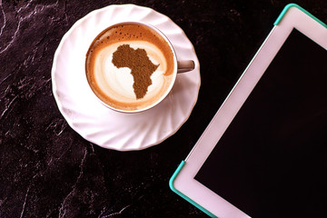 Cup of cappuccino with a picture of Africa