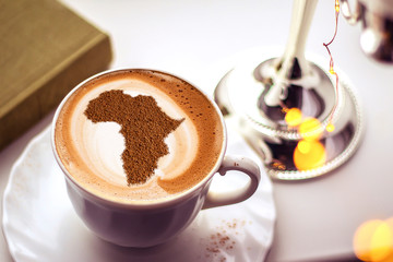 Cup of cappuccino with a picture of Africa