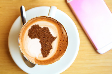 Cup of cappuccino with a picture of Africa