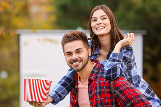 Young Couple Having Fun In Outdoor Cinema