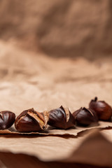 Roasted chestnuts on paper background