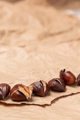 Roasted chestnuts on paper background