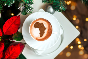 Cup of cappuccino with a picture of Africa
