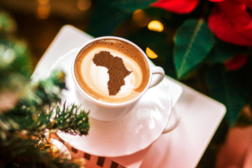Cup of cappuccino with a picture of Africa