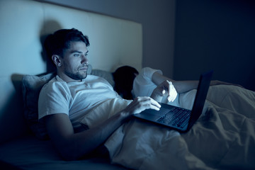 Fototapeta premium man sitting on sofa and watching tv
