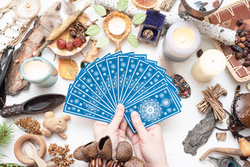 Tarot cards in fortune teller hands close up. Future reading.