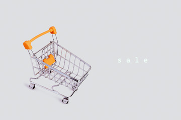 Banner with shopping cart and text. Grocery shopping and sale concept. Black friday, online shopping and store concept. Sale discount. Business background with copyspace. Stock photography.