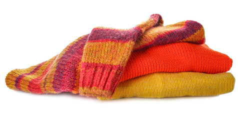 Stack of clean clothes on white background