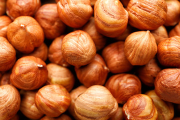 Many tasty hazelnuts as background