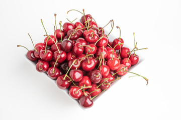 Fresh Cherries In A Square Porcelain White Bowl