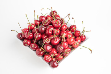 Fresh Cherries In A Square Porcelain White Bowl