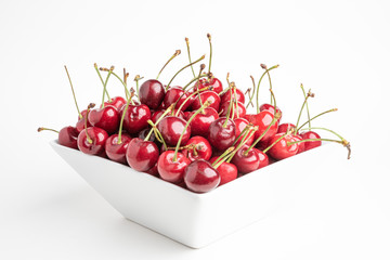 Fresh Cherries In A Square Porcelain White Bowl