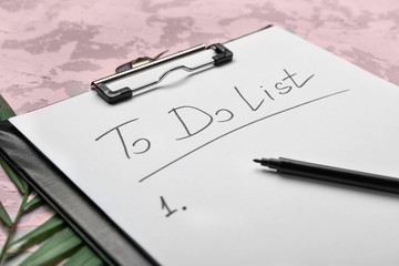 Paper sheet with blank to-do list on table, closeup