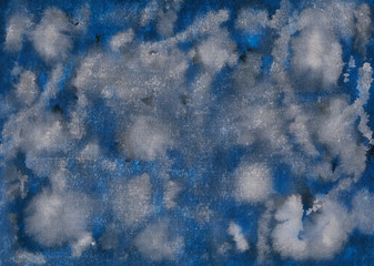 Hand-drawn watercolor grunge background in modern fashion trend color of the year 2020 Pantone Classic Blue. Imitation of clouds with dark and light stains in the sky. High resolution texture